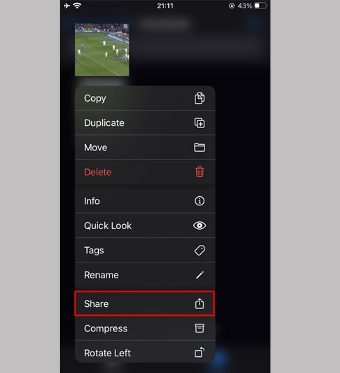 Hold your finger on the video, a menu will appear. Click the 